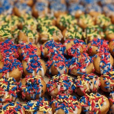 Doughnuttery sprinkle and frosting covered donut holes